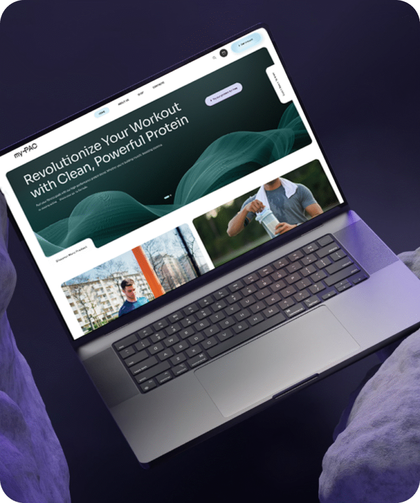 Laptop displaying a clean, modern website design for a fitness protein brand.